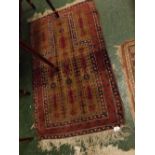 Small Bokhara style prayer rug, with repeating lozenges, with a cream ground decorated in mainly