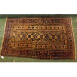 Small cream and rust ground rug with four floral lozenges to centre with a multi gulled border, 30 x