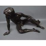 Late 20th century bronzed finish figure of a reclining man holding a book (limited edition No 466/