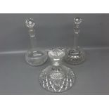 Near pair of clear glass decanters with bulbous base, canted neck and faceted stopper, together with