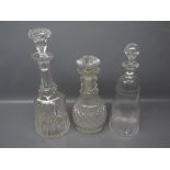 Mixed Lot: three clear glass decanters to include cut glass mallet-formed decanter, and etched and