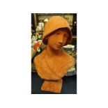 Composition terracotta coloured bust of young girl wearing a bonnet, raised on square plinth,