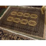 Modern carpet with multi gull border, with central interlocking lozenges with mainly grey ground,