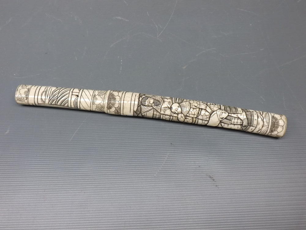 Early 20th century bone tanto dagger, with steel blade and carved bone scabbard with figural