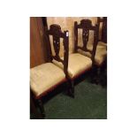 Set of four Edwardian walnut framed dining chairs, with carved urn splat back and grape and vine