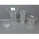 Four pieces of 20th century clear glass to include a heavily cut trumpet style vase together with