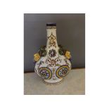 A 19th century Gien moon flask vase, decorated in blue & yellow with various mythical figuresand