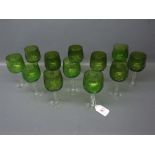 Set of 12 green bowled wine glasses on clear stems and feet