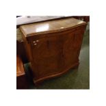 Late 20th century figured walnut side cabinet, quarter veneered top with carved moulding and