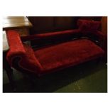 Edwardian walnut chaise with red velvet upholstered seat and button back, open splat and carved leaf