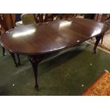 Late 20th century mahogany extension dining table, with moulded 'D' ends and fitted with two