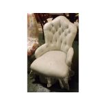 Late 19th century button upholstered bedroom chair, with shaped back and stuff-over seat on carved
