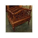 Late 19th century walnut Canterbury with foliate pierced panels and bobbin insets, fitted with a