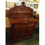 Victorian mahogany serpentine fronted chiffonier, top fitted with fixed shelves with squat column