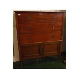 Late 20th century mahogany chest of three drawers with cupboard base on turned legs, width 42ins