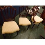 Modern set of six dining chairs (4 + 2 carvers), each with carved shield-shaped backs and splats