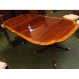 Modern mahogany and crossbanded extension dining table, with shaped D-ends and fitted with three