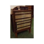 Glazed side cabinet containing a set of Encyclopaedia Britannica, height 42ins, width 25 1/2 ins