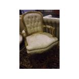 20th century French style and gold painted armchair upholstered in cream damask fabric, button