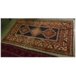 Mid-20th century Bokhara carpet with blue ground and 3 diamond lozenge to centre with geometric