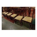 Set of six early 20th century mahogany splat back dining chairs with green velour drop in seats with