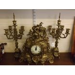 French brass clock garniture, with enamel Arabic chapter ring with heavily brass cast detail with