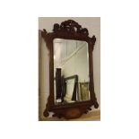 Georgian mahogany fretwork mirror, with ho-ho bird to top and inlaid shell detail to base, 21ins x