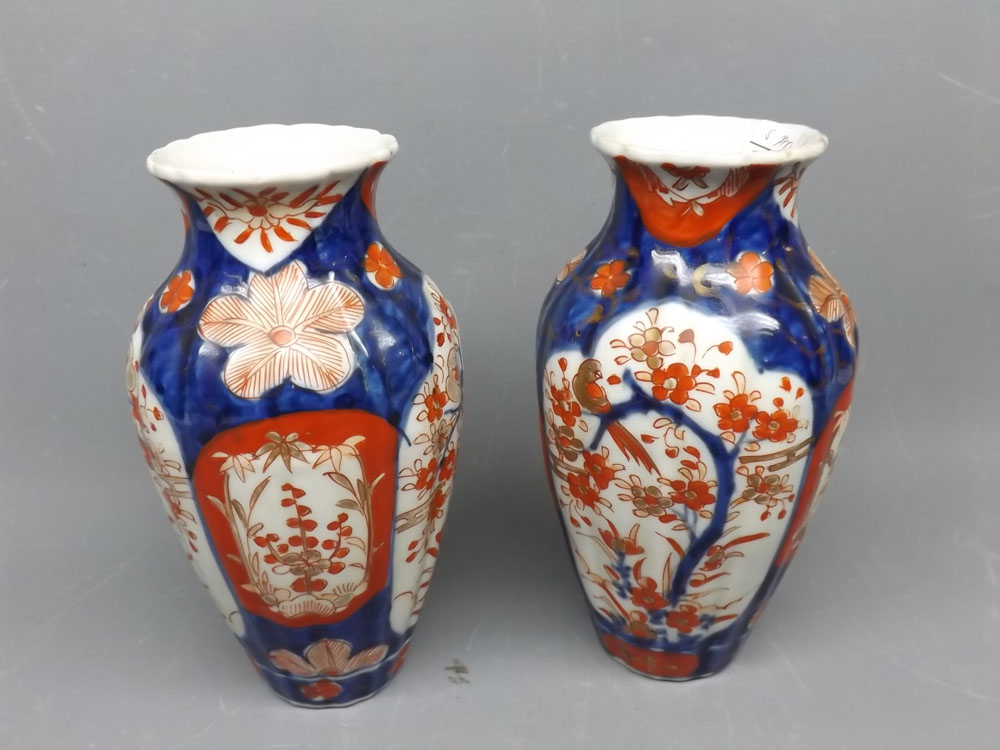 Pair of early 20th century Imari decorated bulbous vases, with floral and bird of paradise scenes,