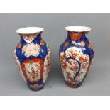 Pair of early 20th century Imari decorated bulbous vases, with floral and bird of paradise scenes,