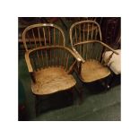 Pair of 19th century elm seated stick back armchairs, supported on H-stretchers, each 21ins wide x