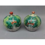 Near pair of 20th century Chinese cylindrical lidded vases, in cabbage leaf style decoration with