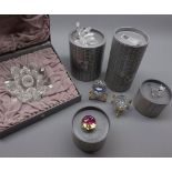 Five boxed Swarovski crystal ornaments: lotus flower candle stick; cat; crystals and butterfly (A/F)