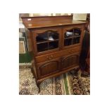 Edwardian mahogany side cupboard, with two glazed segmented doors over single full width drawers