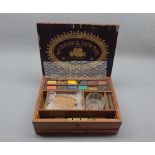 Mahogany cased and ebony banded Winsor & Newton artists box, with fitted interior, 9 1/2 x 7ins