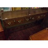 18th century oak framed dresser base, fitted with three drawers with brass swan neck handles and