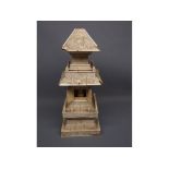 Late 19th or early 20th century model of a pagoda house, with opening doors and seated figure,