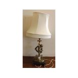 Marble and brass electric lamp with square black marble plinth, mounted putti, sconce to