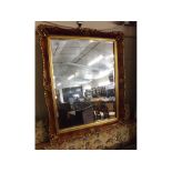 Walnut effect and gilt rectangular mirror, 19ins wide x 23 ins deep