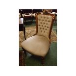 19th century walnut framed nursing chair with mushroom coloured upholstered seating and button back,