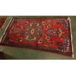 Caucasian red red ground wool wash rug with geometric designs, 43ins x 77ins