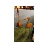 Two metal garden models of storks, largest 56ins tall