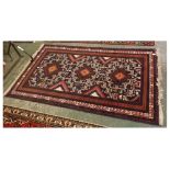 Caucasian rug with geometric designs with three central lozenges and multi gull border, 47ins x