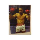 Signed photographic print depicting Michael Watson (b 1965), the boxer with his arms aloft, signed