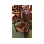 Victorian oak carver or throne chair, elaborately carved and crested with twining foliage, twisted