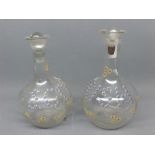 Two 19th century Austrian enamelled decanters, one painted with the wording "Irish" in flowers and