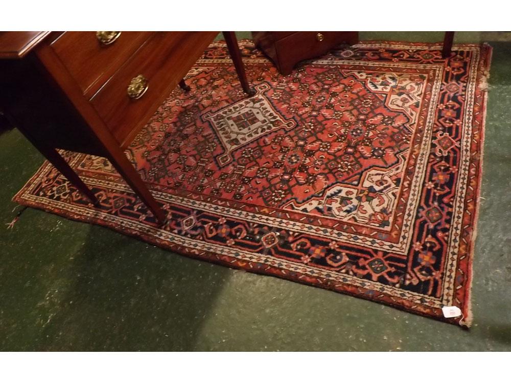 Modern Caucasian red ground carpet with central cream diamond lozenge with geometric floral