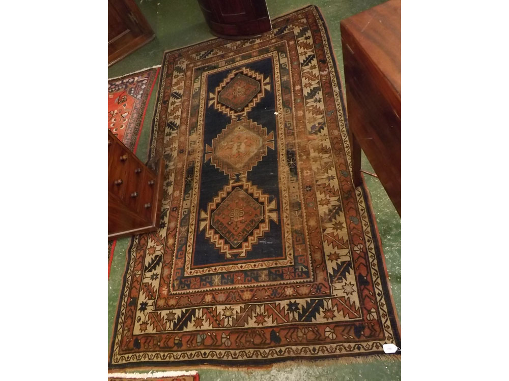 Mid-20th century Bokhara carpet with blue ground and 3 diamond lozenge to centre with geometric