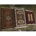 Mixed Lot: three various small modern woollen mats, each with geometric borders and fields,