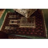 Caucasian style small rug, central geometric panel, mainly brown and beige field, together with a