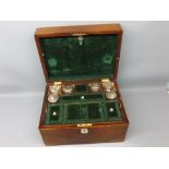 Victorian rosewood vanity case, the hinged lid opening to reveal a green velvet lined interior